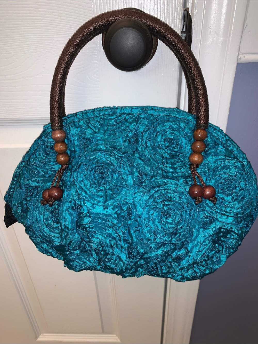 Turquoise rose-embellished clutch handbag great condition